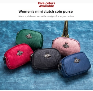 Macro shot of double zippers and lychee grain leather texture on mini bee coin purses