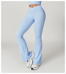 Detail of high-waisted yoga flare pants with a crossover V-waistband in light blue