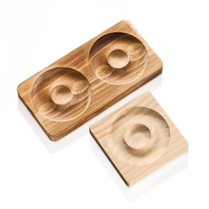 Detail of rectangular and square wooden jewelry trays showing natural pine grain and texture
