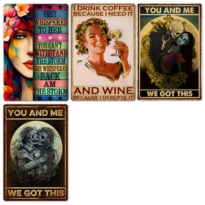 Detail of vintage metal garden signs with inspirational English quotes and retro artwork