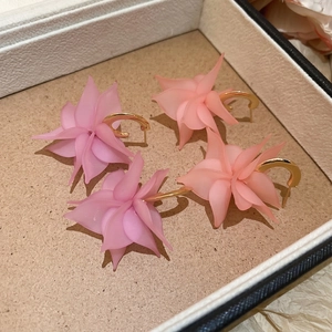 Elegant C-shaped acrylic petal earrings with matte finish and polished gold metal hooks