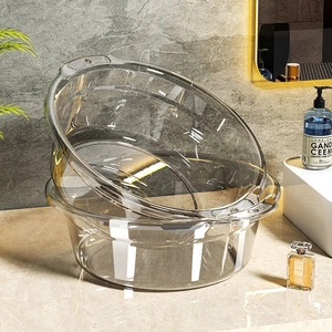 Modern transparent grey washbasins in a set with ergonomic handles for bathroom use