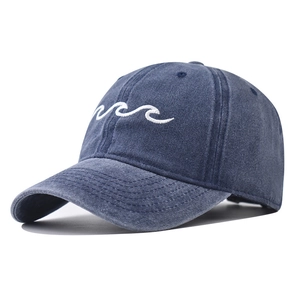 Vintage washed navy baseball cap featuring white wave embroidery on the front side