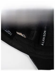Detail of widened sweatband in black baseball cap with moisture-wicking technology