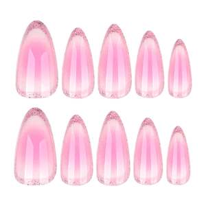 Elegant pink almond-shaped press-on nails featuring ombré gradient and glitter tips
