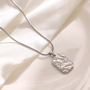Silver square pendant necklace with textured finish on a sleek snake chain for women