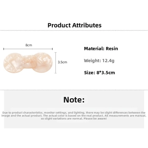 Detail view of marble resin bow hair clip with 8cm length and 12.4g weight specifications