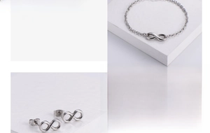 Detail view of titanium steel jewelry set featuring infinity symbol earrings and bracelet