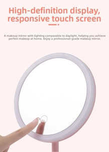 Close-up of a pink LED vanity mirror showing the sensitive touch sensor switch