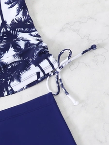 Detail of tropical palm tree print tankini top with adjustable side drawstring ties