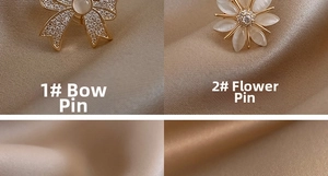 Vue détaillée de broches nœud et fleur avec pierres œil-de-chat et cristaux pavés