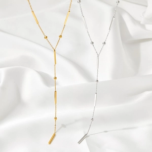 Minimalist Y-shaped stainless steel necklace with bar and bead pendants in gold and silver
