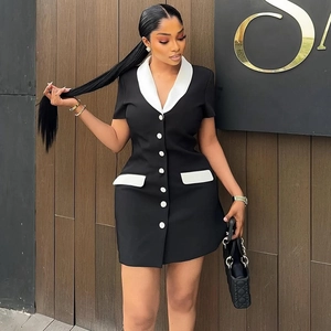 Slim fit black mini dress with white contrast lapels and buttons shown on model