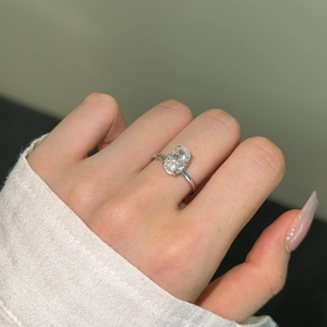 Detailed close-up of a 925 silver ring featuring a large oval-cut sparkling gemstone