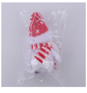 Detailed view of glowing Christmas snowman ornament featuring red hat and scarf