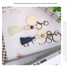Detail view of boho tassel keychains with wood beads and silicone leopard print charms