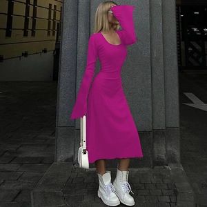 Detail of fuchsia ribbed knit dress featuring slim fit long sleeves and crew neck