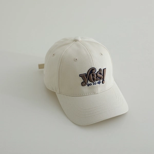 Detailed close-up of embroidered 'Yes! go to up' text on cotton twill baseball cap