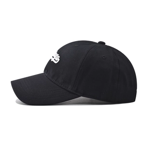 Side view of black cotton vintage baseball cap with 3D white embroidery and a curved brim