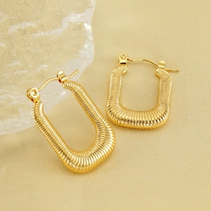 Polished 18K gold plated ribbed rectangular hoop earrings for women on a beige background