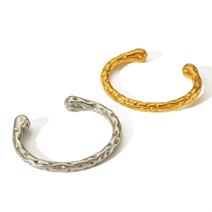Minimalist C-shaped stainless steel bracelets with lava hammer texture in gold and silver