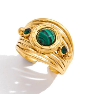 Detail of multi-layer 18K gold stainless steel ring with green malachite and side stones