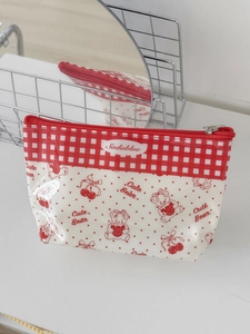 Detail of waterproof PVC pouch featuring cute cartoon bear and red cherry patterns