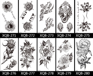 Detail view of ten black and white tattoo stickers featuring flowers and compass designs
