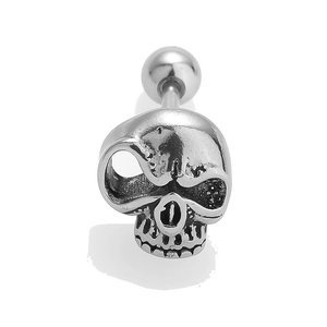 Macro detail of a silver punk skull stud earring with a threaded ball back design