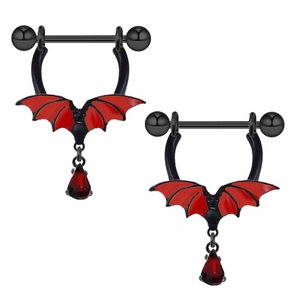 Macro detail of black bat nipple rings with red wings and teardrop zircon pendants