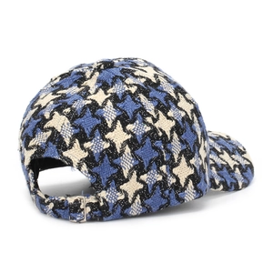 Detail of blue plaid tweed baseball cap featuring an adjustable metal buckle strap