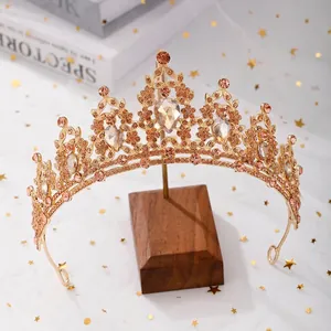 Luxurious gold alloy bridal crown with champagne pear-shaped crystals and rhinestones
