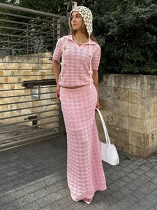 Pink knit two-piece set featuring a hollow-out short sleeve polo top and maxi skirt