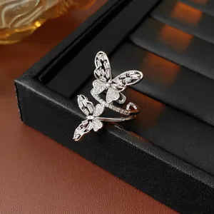 Silver hollow butterfly open ring with sparkling cubic zirconia on luxury jewelry box