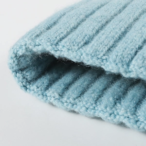 Light blue thick knit beanie hat with warm ribbed texture and soft wool-like finish