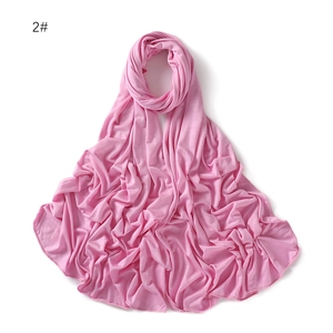 Detail of soft pink mercerized cotton jersey scarf showing fine stitching and smooth texture