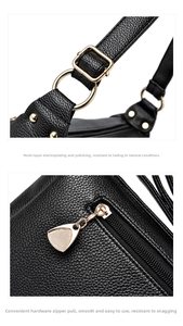 Detailed view of the black lychee pattern leather strap with gold buckle and smooth metal zipper