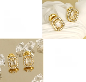 Macro detail of gold-plated double-layer cubic zirconia stud earrings with high-polish finish