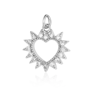 Close-up of silver heart pendant with cubic zirconia in a radial sunburst design