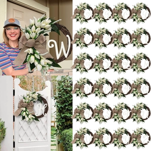 Artificial tulip wreath with burlap bow and white initial letter for front door decor