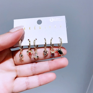 6-piece gold hoop earring set with heart, skull, and colorful zircon charms for women