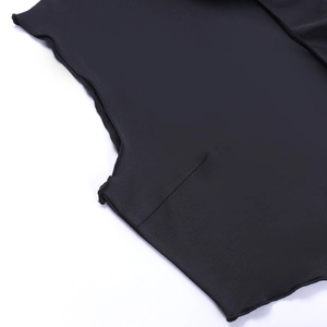 Detail of black knit fabric showing high-quality stitching and wavy ruffled lettuce edges