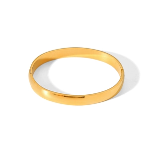 Detailed macro view of the polished gold stainless steel bangle with side hinge closure