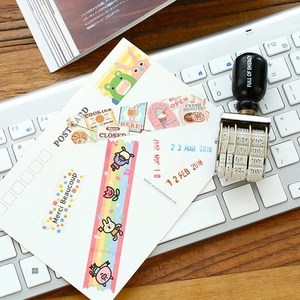 Vintage wooden roller date stamp with Full of Energy text on a modern desk setup