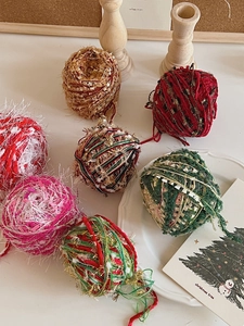 Detailed view of colorful DIY Christmas tree mixed yarn balls for festive decorations