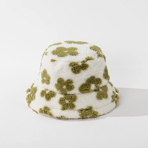 Detailed view of the soft fleece texture and green floral pattern on the bucket hat