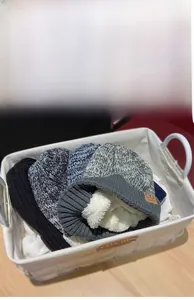 Detail of thick fleece lining inside the knitted beanie hats for winter warmth