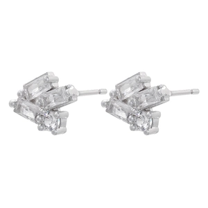 Detailed macro view of silver geometric stud earrings with baguette and round cut zircons