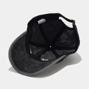 Inside view of vintage washed charcoal cotton baseball cap showing lining and labels