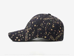 Side view of dark blue baseball cap with beige paint splatter and NY&GD embroidery